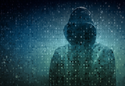 Mysterious cybersecurity hacker a hooded sweatshirt