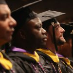 Bearded man smiling during graduation