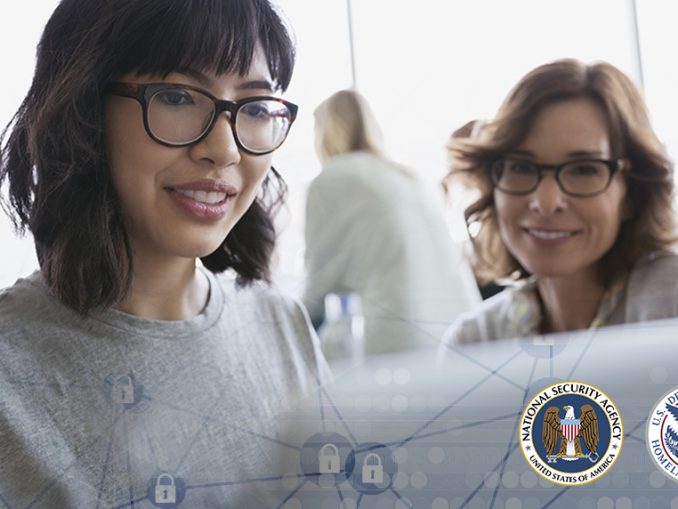 two women looking at a laptop
