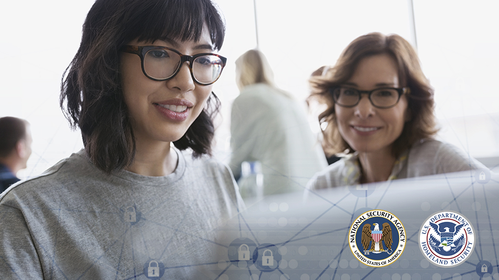 two women looking at a laptop