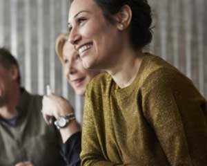 AS in Liberal Arts graduates conversing and smiling