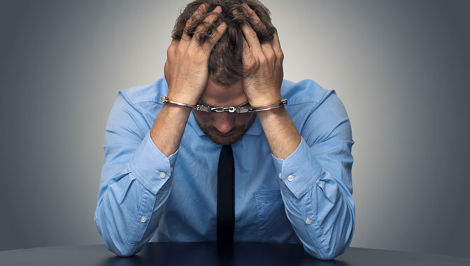 Man holding head in hands