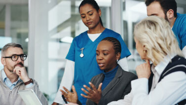 Health Science professionals gathered together in a meeting