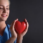 nurse holding a heart