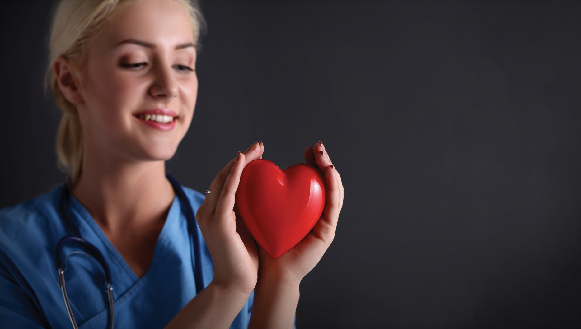 nurse holding a heart