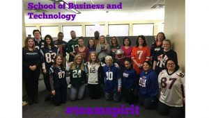 excelsior employees dressed in football jerseys