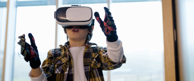 Child using virtual reality goggles