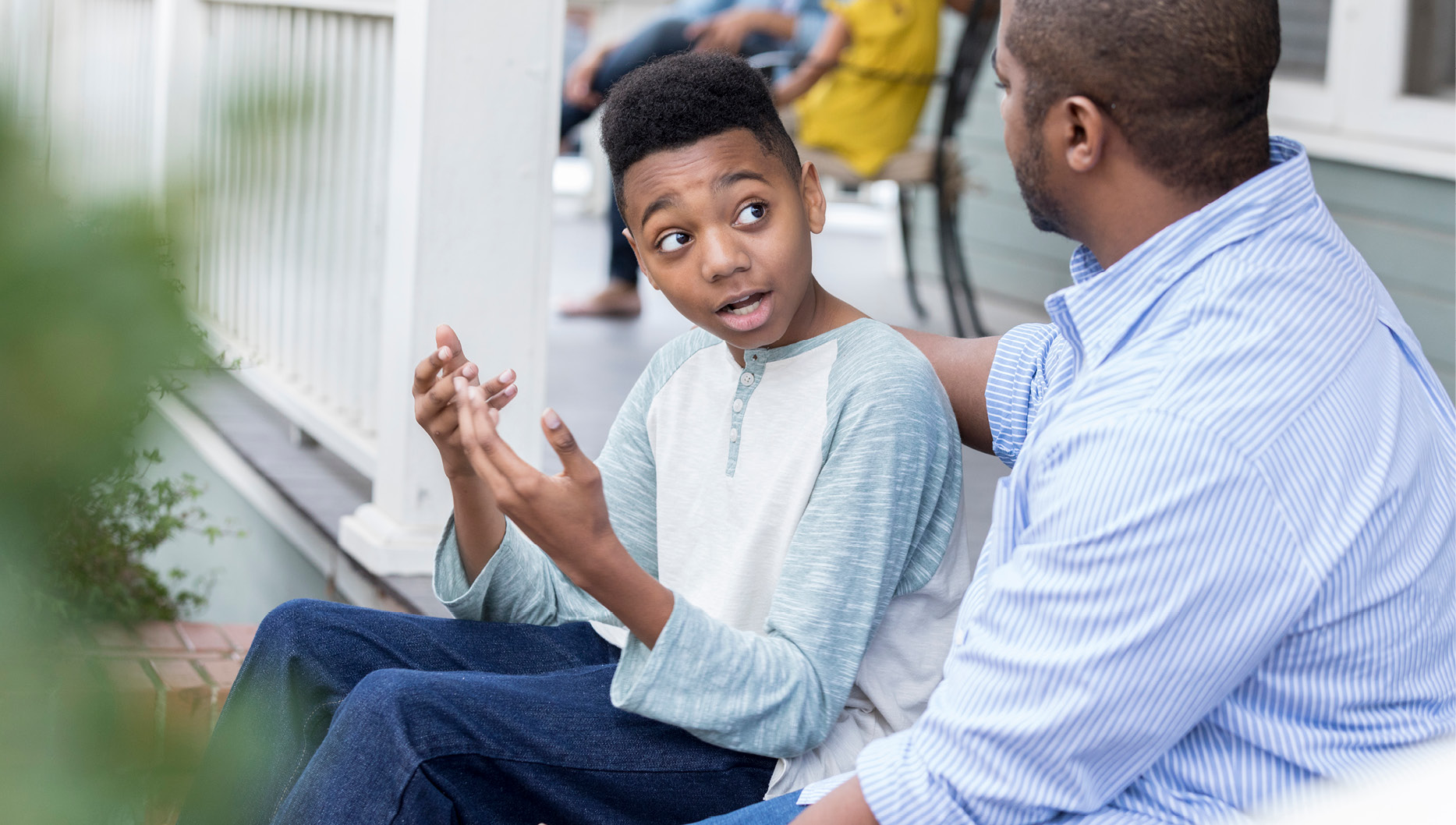 african american dad talking to son instead of putting him in time out