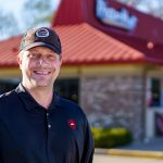 Ron Kiernicki, Excelsior Student in front of the Pizza Hut he works for