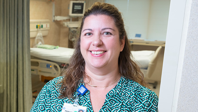 Phyllis St. John, who holds three nursing degrees, in her workplace