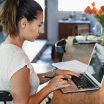 woman at computer, going back to school with GI Bill Benefits