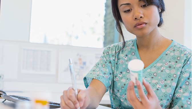 nurse reading prescription bottle, nursing STEM?