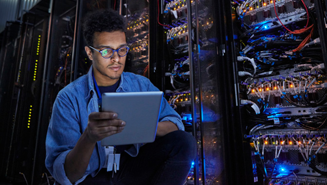 Man in server room, it and cyber roles