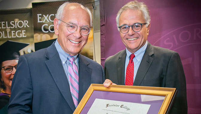 President James N. Baldwin awarding an honorary degree to Rep. Paul D. Tonko