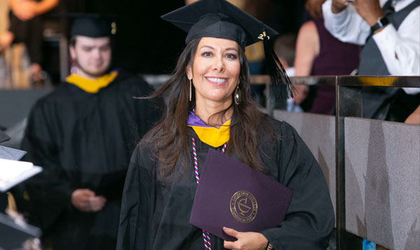 Excelsior University student at commencement