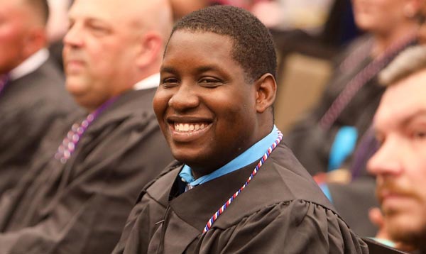 Graduating student smiling