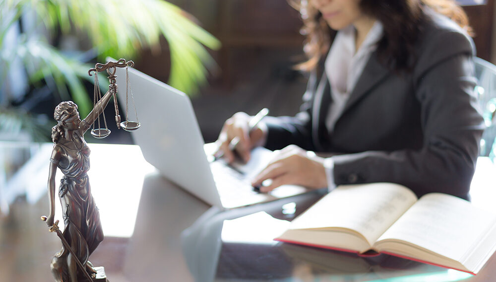 A criminal investigator reviews her notes before trial. She advanced her career in criminal justice through Excelsior University’s online master’s program in criminal justice.