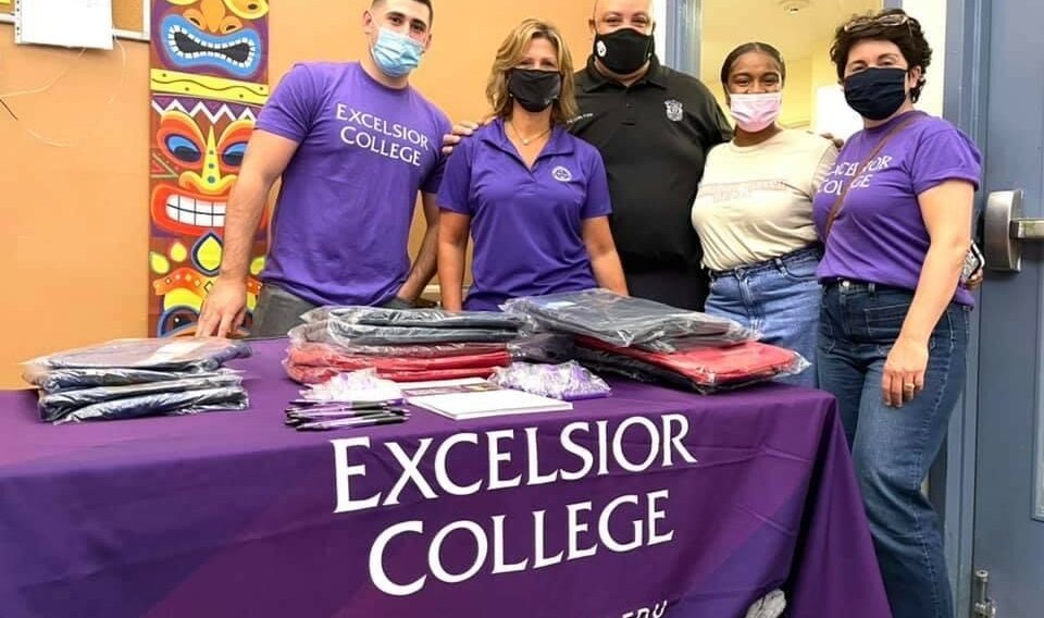 Excelsior College employees at the school supply drop off event