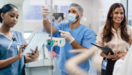 male nurse in scrubs in surgery setting