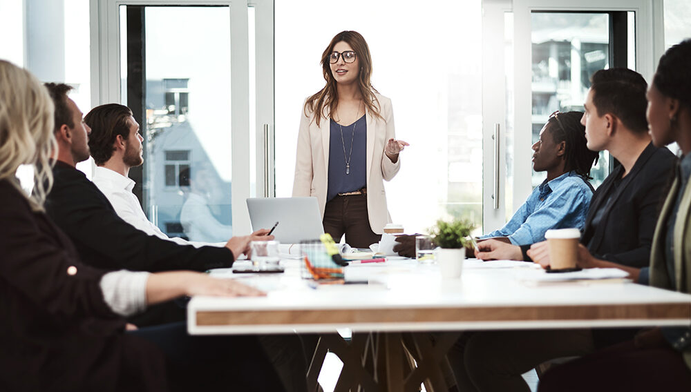 a business manager leading her team