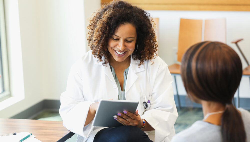 Registered dietician with patient