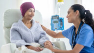 oncology nurse with female cancer patient