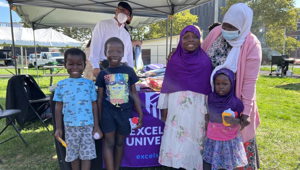 Excelsior staff donate backpacks