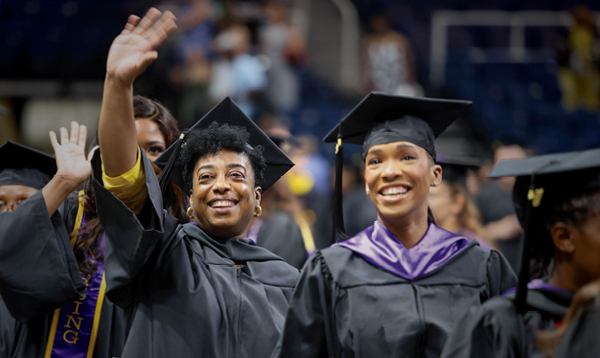 Two Excelsior University studenst at commencement