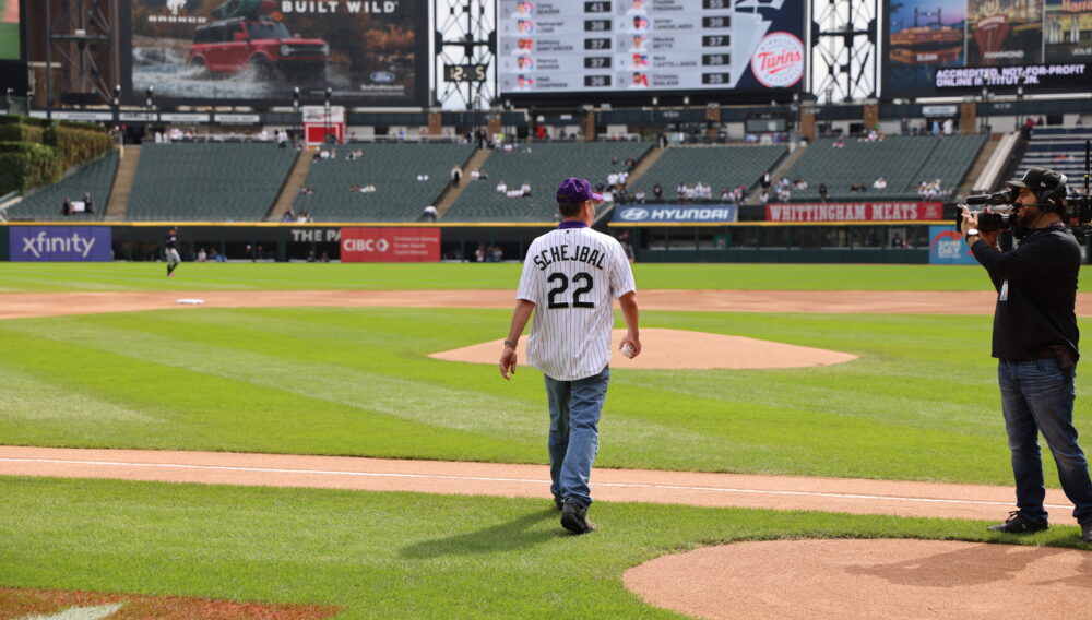 Excelsior's President David Schejbal takes the mound for the first pitch at the White Sox game