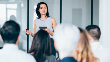 female business leader speaking to co-workers