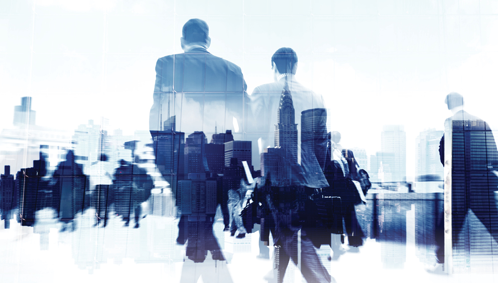 group of businessmen with city skyline backdrop