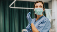 female nurse in scrubs in hospital setting