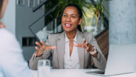 Woman with a career in human resources, seated and midconversation