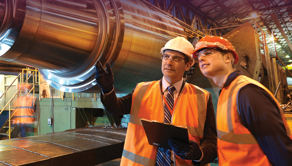 two male engineers in a warehouse