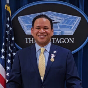 Benjamin Bryant behind a podium at the Pentagon
