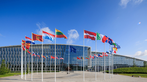 NATO Headquarters in Brussels, Belgium showing a ring of national flags.