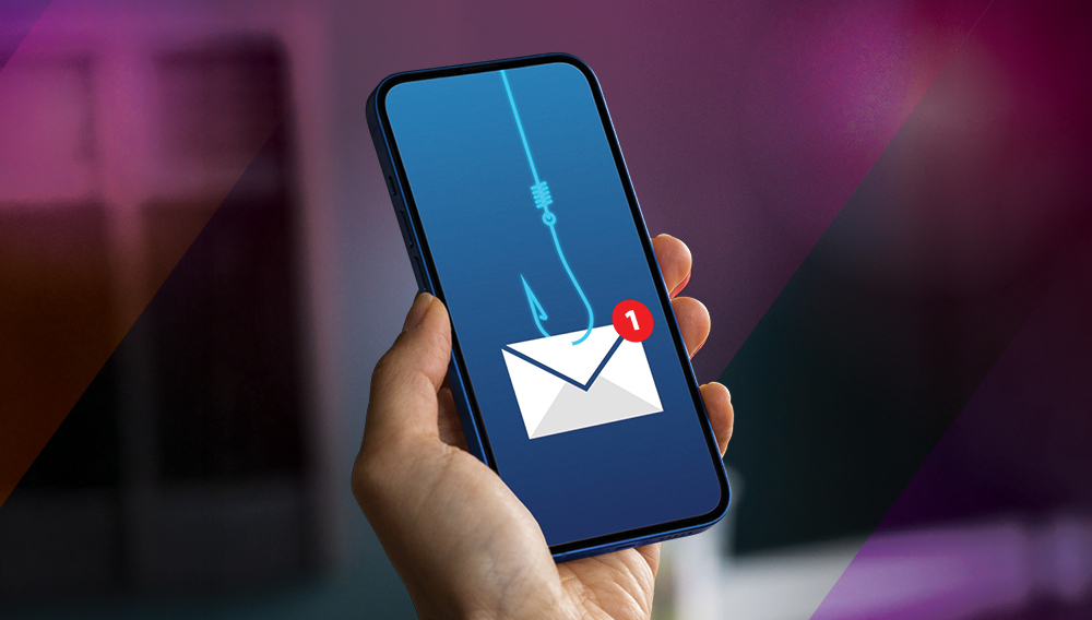 Hand holding smartphone with an email icon on the screen with a fishing hook and line attached