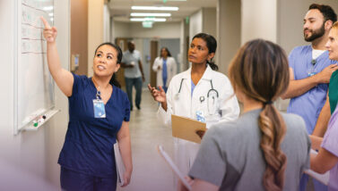 Nurse leading a meeting in a hospital