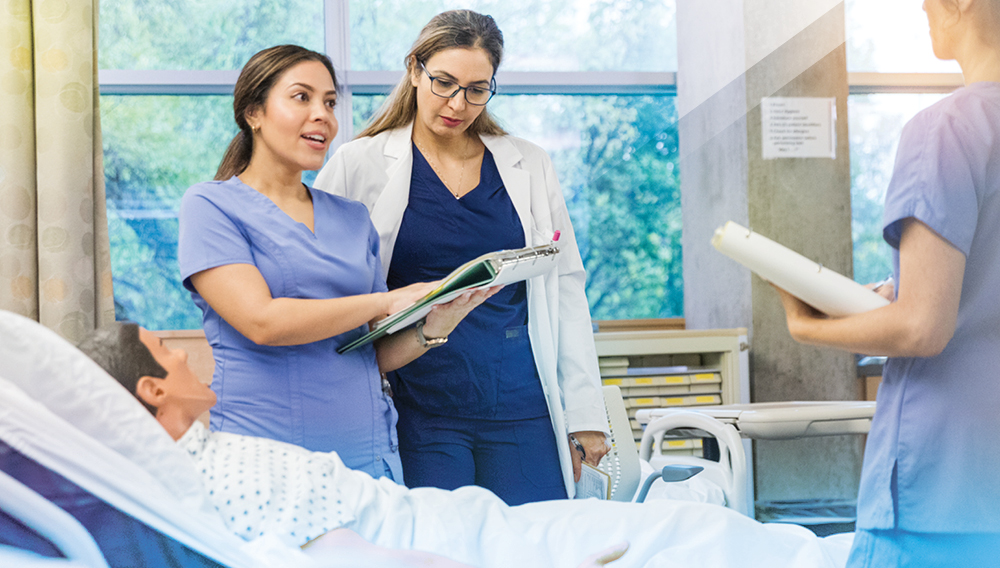 Students taking part in a nursing degree program lab experience