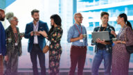 Businesspeople smiling and shaking hands