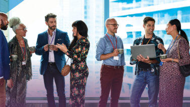 Businesspeople smiling and shaking hands