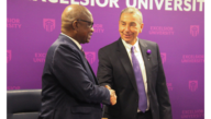 Presidents of Excelsior University and UVCI shake hands